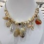 red-colored necklace with shells and seafood charms